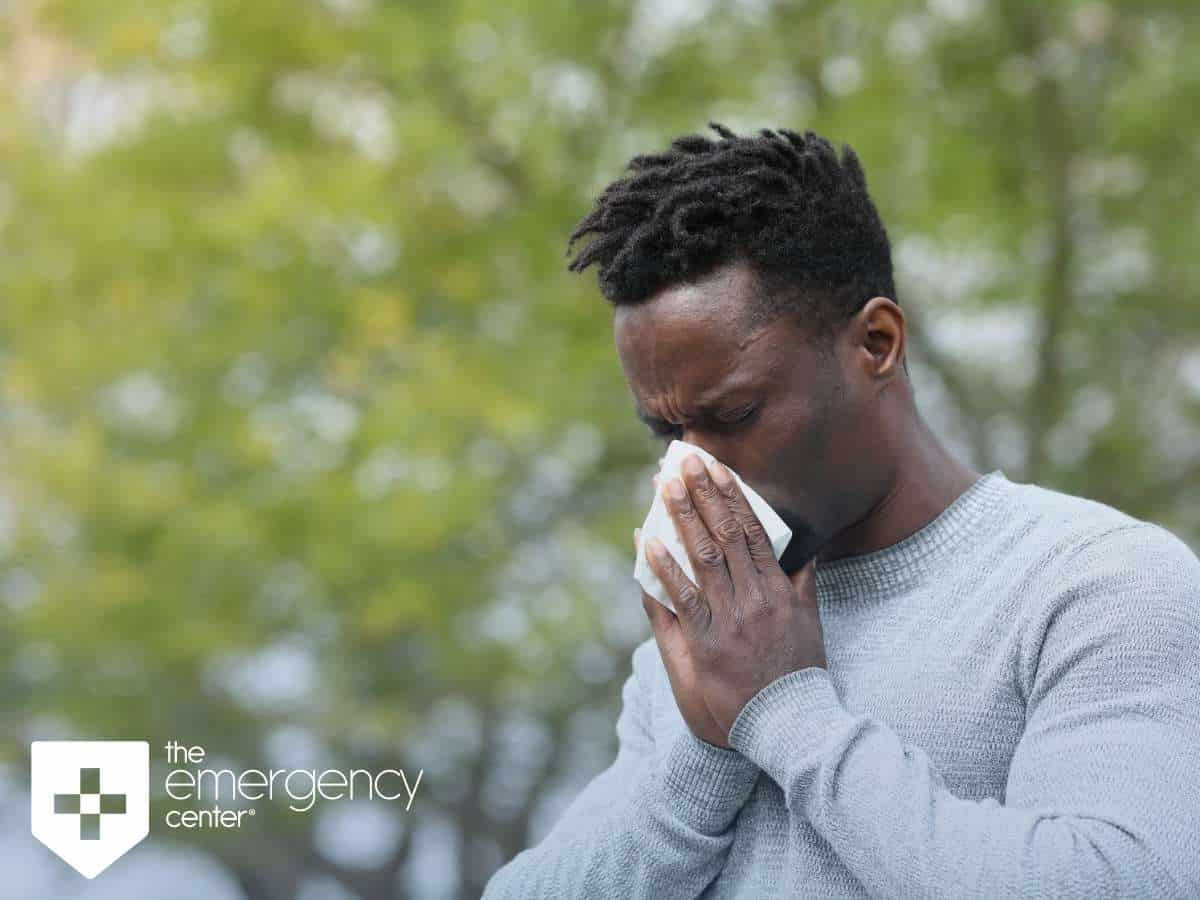 Man Sneezing because of springtime allergies in San Antonio, TX