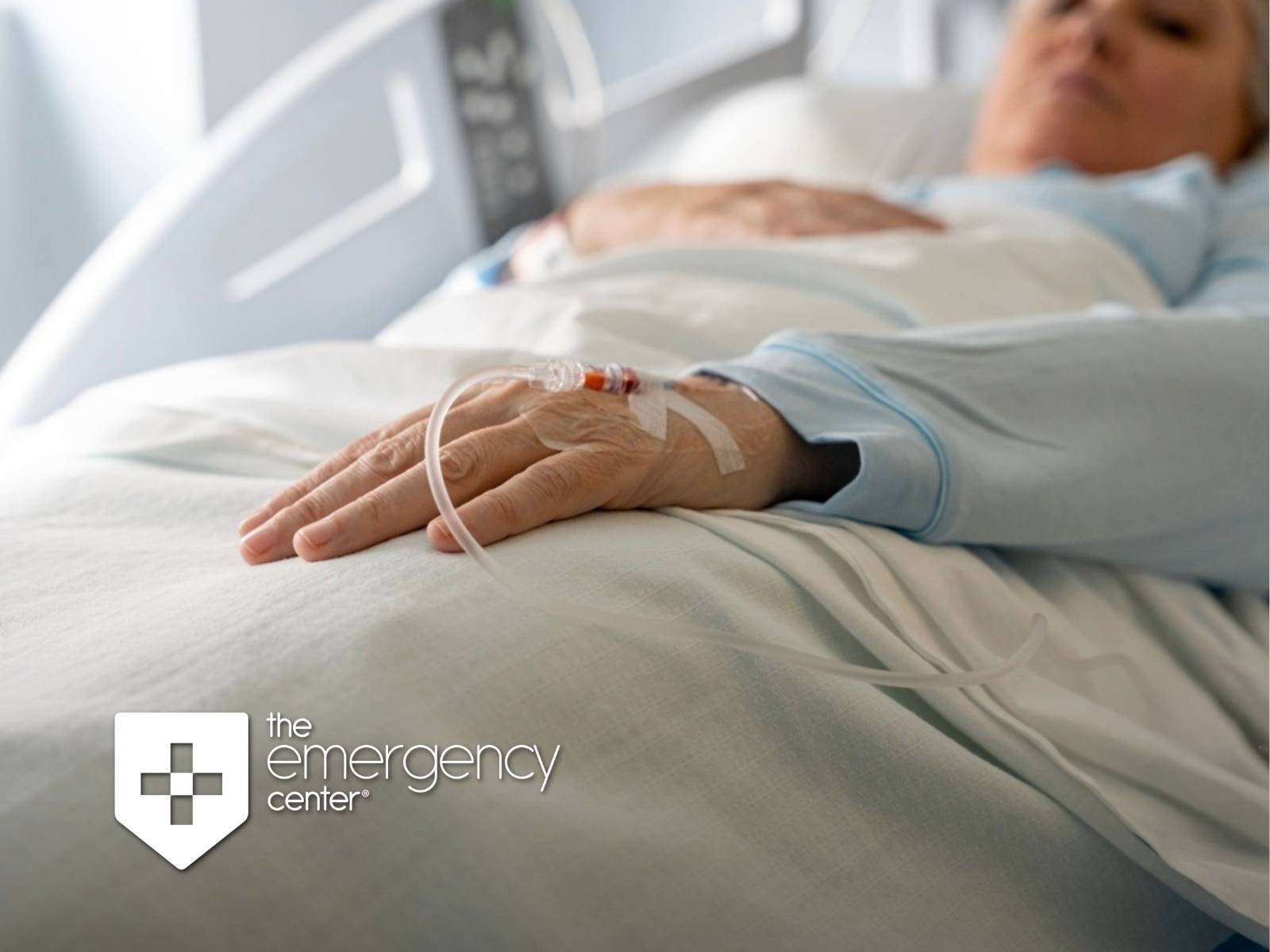 Patient resting in a hospital bed with an IV line in the hand during emergency treatment for sepsis